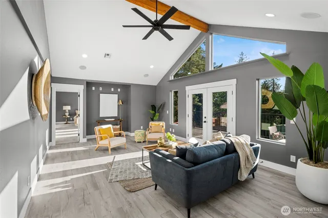 a living room with furniture and a large window