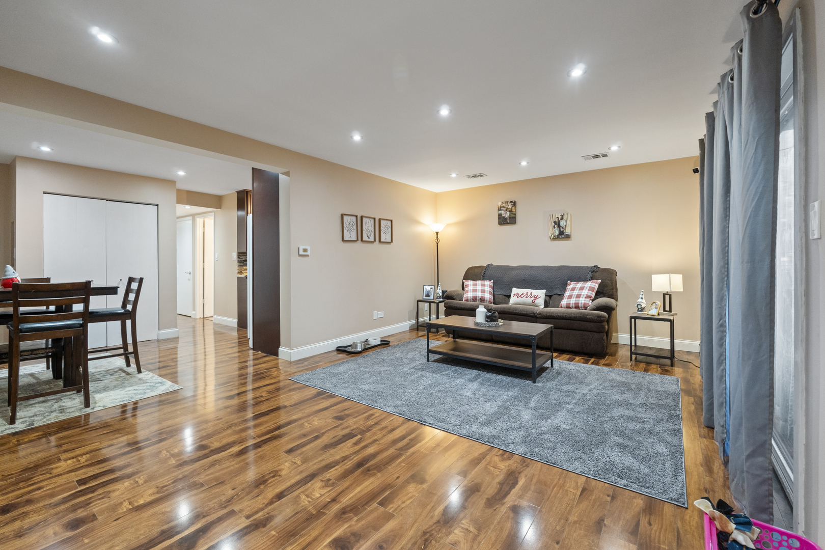 9645 South Harlem Avenue, Unit 1H Chicago Ridge, IL 60415 - Photo 14 of 14 a living room with furniture and a wooden floor