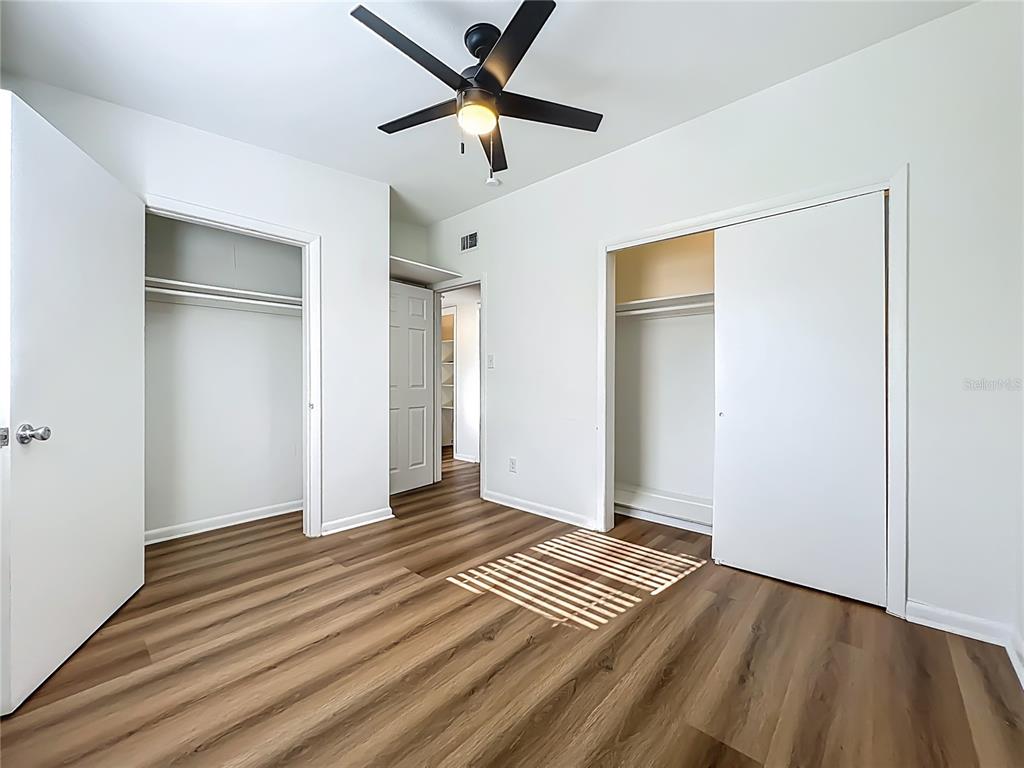 2001 Conway Gardens Road Orlando, FL 32812 - Photo 7 of 11 wooden floor in an empty room with a window