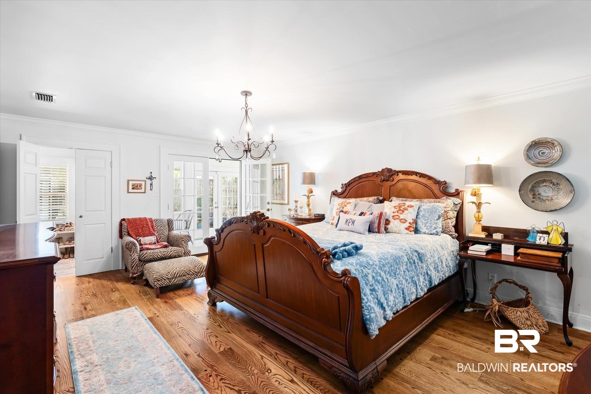 202 Woodlands Avenue Mobile, AL 36607 - Photo 14 of 53 Bedroom with crown molding, an inviting chandelier, and light wood-type flooring