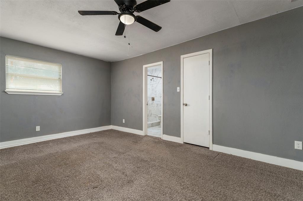 1101 Kennedale Sublett Road Kennedale, TX 76060 - Photo 16 of 35 Spacious room featuring gray walls, brown carpet, and a ceiling fan with integrated lighting