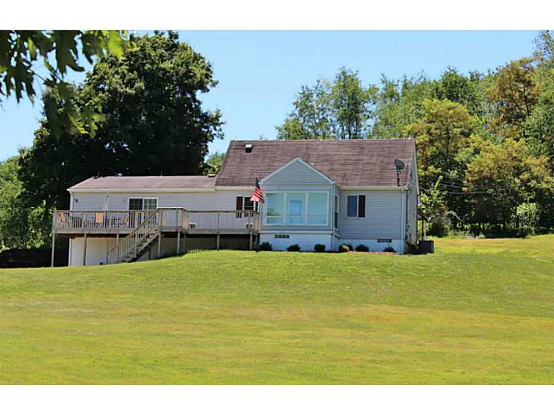 Exterior Front. This home is situated on 1.04 acres of beautiful property.  You will fall in love with the care that has been given to this home, while relaxing on the deck or sun porch watching the horses in the field near by.