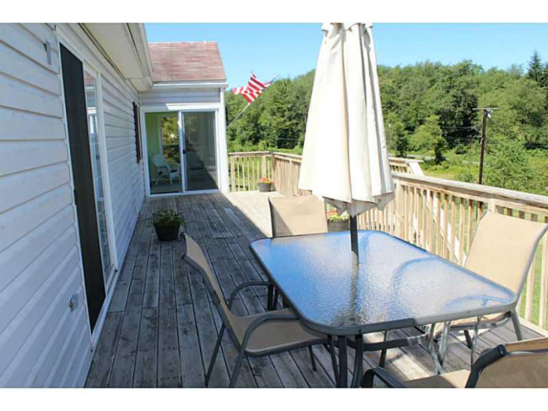 111 Long Road Georgetown, PA 15043 - Photo 21 of 25 Patio/Deck. Large deck with room for dining, and extra room for outside seating if wanted. Deck can be entered from the front of the home, off the sunroom and the living room. Great for enjoying the coffee and entertaining.