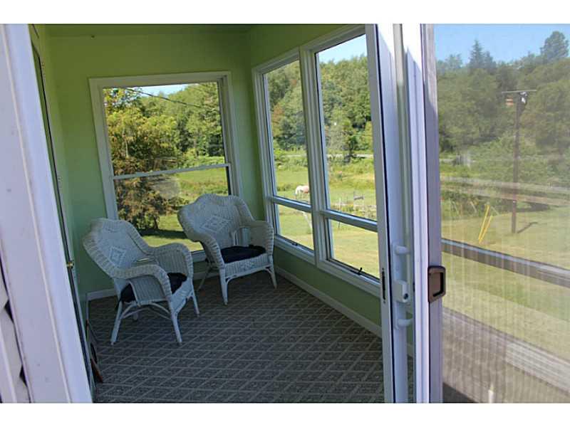 111 Long Road Georgetown, PA 15043 - Photo 5 of 25 Sunroom. Such a relaxing spot away from the elements to enjoy the views and read your favorite book or enjoy your morning coffee.