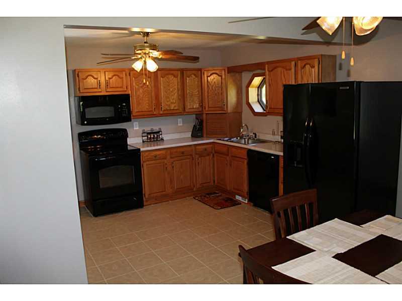111 Long Road Georgetown, PA 15043 - Photo 8 of 25 Kitchen. View of the dining room/kitchen area. Comfortable for family meals and large enough for holiday functions. Newer appliances make this kitchen a breeze to cook and entertain.
