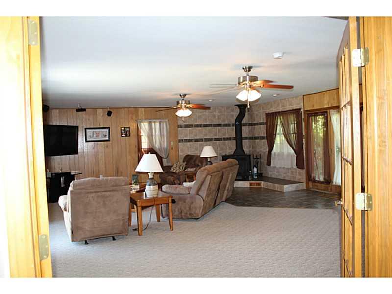 111 Long Road Georgetown, PA 15043 - Photo 10 of 25 Living Room. This living room has wall to wall and ceramic flooring with sliding glass doors, wood/coal burner, French doors. Wait till you see this space. Large enough for a pool table to be placed in this room also.
