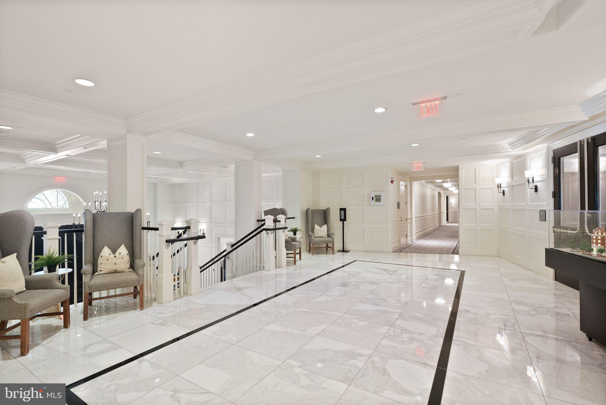 6900 Fleetwood Road, Unit 415 McLean, VA 22101 - Photo 5 of 51 a lobby with furniture and a large mirror