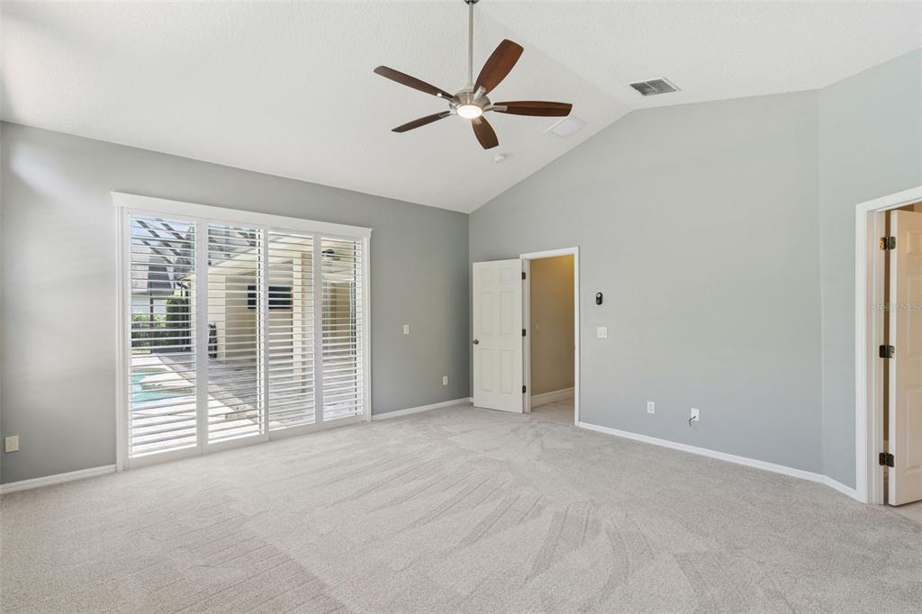 2230 Ridgewind Way Windermere, FL 34786 - Photo 19 of 38 a view of an empty room with a ceiling fan