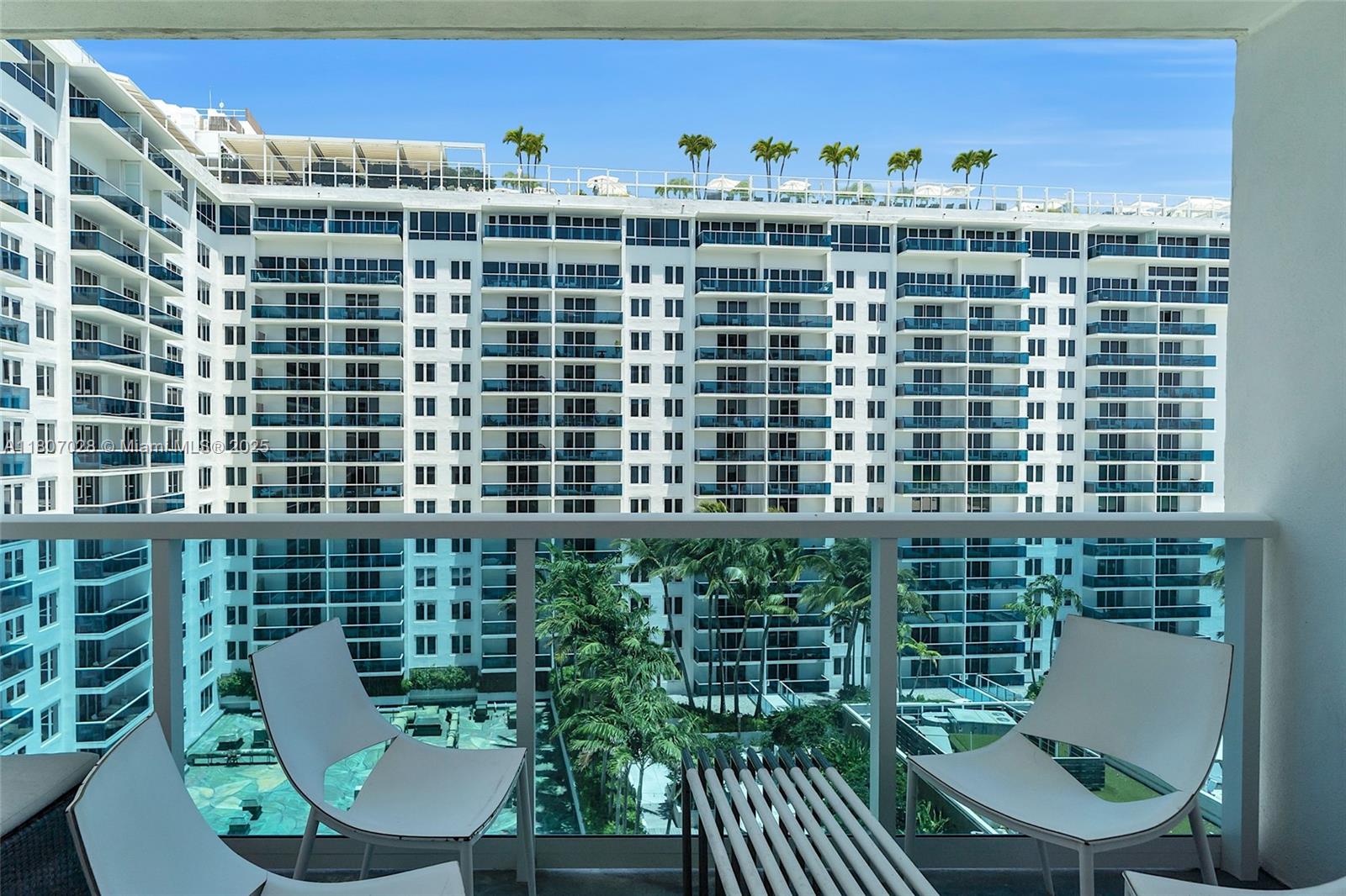 2301 Collins Avenue, Unit 1019 Miami Beach, FL 33139 - Photo 19 of 35 a view of a balcony with chairs