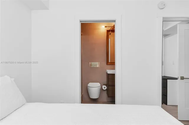 a bathroom with a toilet and a sink