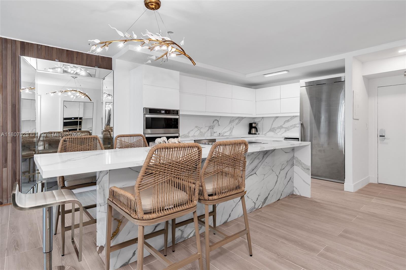 2301 Collins Avenue, Unit 1019 Miami Beach, FL 33139 - Photo 7 of 35 a living room with stainless steel appliances kitchen island granite countertop furniture and fireplace