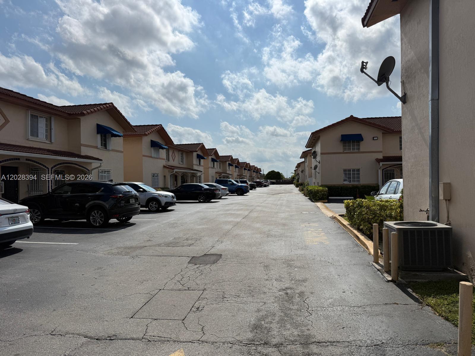 2212 West 74th Street, Unit 20128 Hialeah, FL 33016 - Photo 11 of 11 a car parked in front of a house