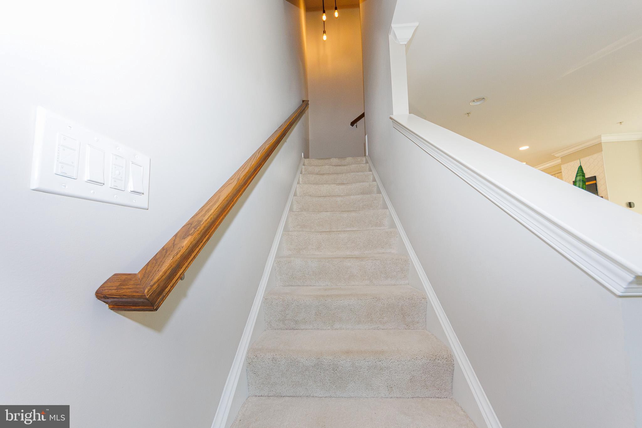 16201 Coolidge Avenue Silver Spring, MD 20906 - Photo 17 of 40 Carpeted stairs to bedroom level