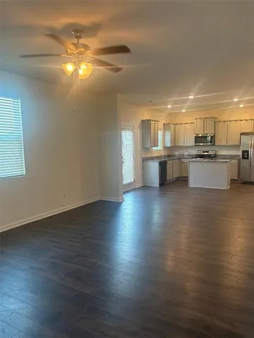 a kitchen with granite countertop wooden cabinets and a granite counter tops