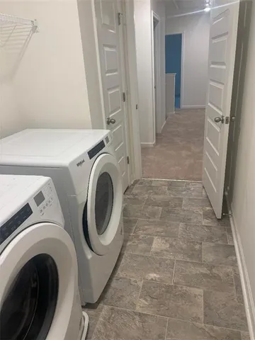 a view of an empty room with a fan
