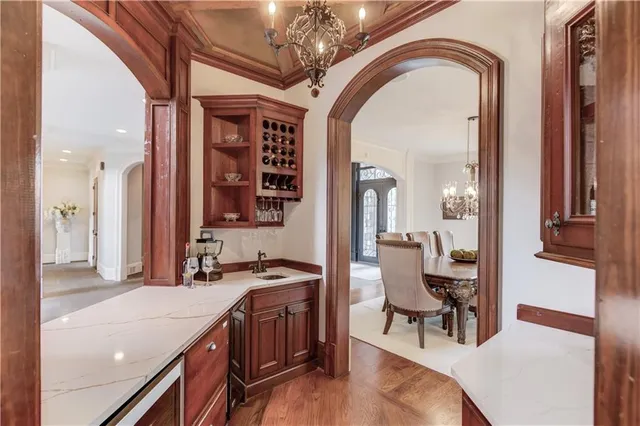 a kitchen with stainless steel appliances granite countertop a stove and a refrigerator