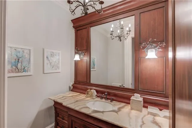 a view of a room with furniture wooden floor and chandelier