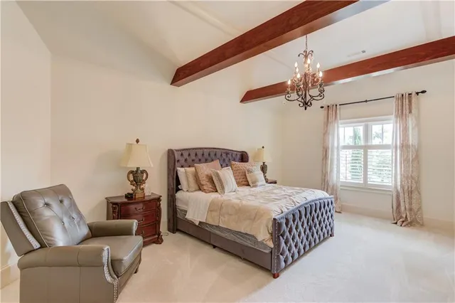 a view of a lake with a swimming pool and a yard