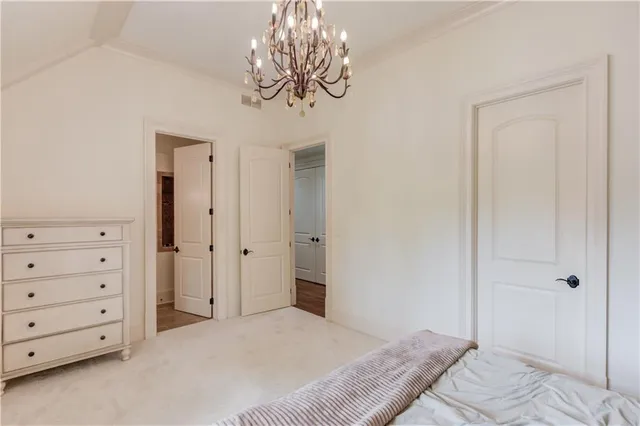 an aerial view of a house with a yard and a large pool