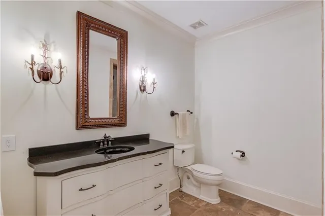 an aerial view of a house with a yard and lake view