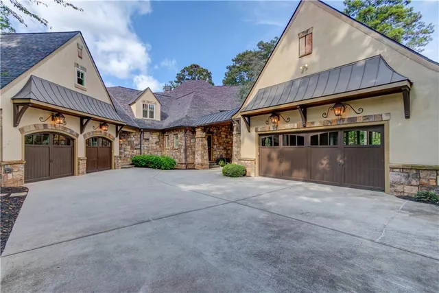 a living room with furniture a fireplace and a large window