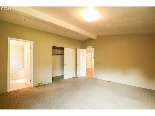 a view of an empty room and window