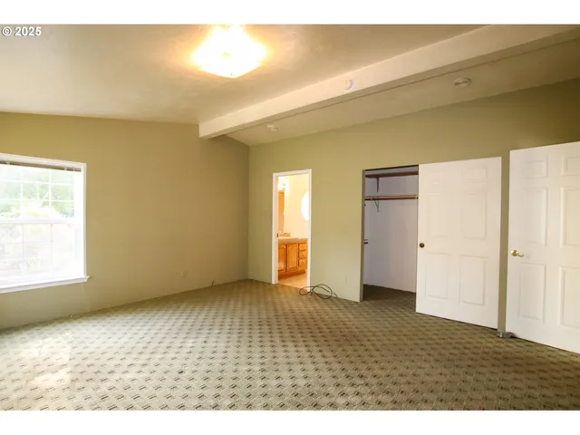 a view of an empty room and window