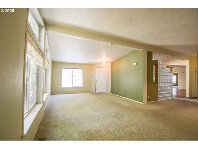 a view of an empty room and window