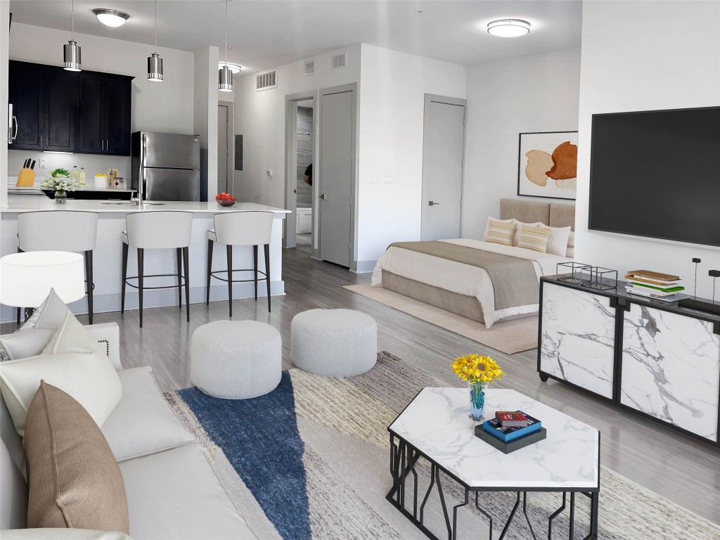a living room with furniture and a flat screen tv