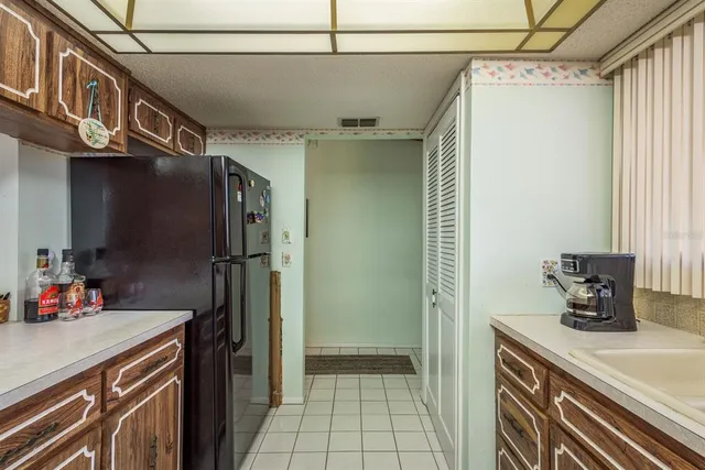a kitchen with stainless steel appliances a sink and a refrigerator
