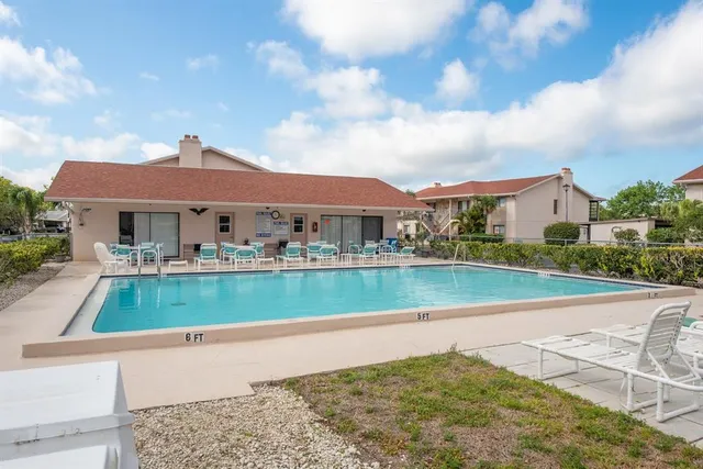 a view of houses with city street and lake view