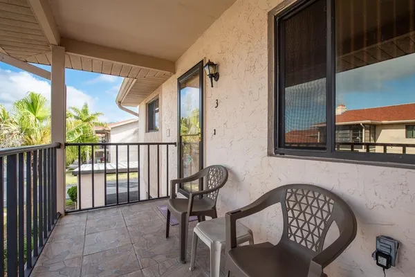 a view of balcony with furniture