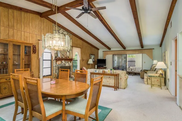 a dining room with furniture window and outside view