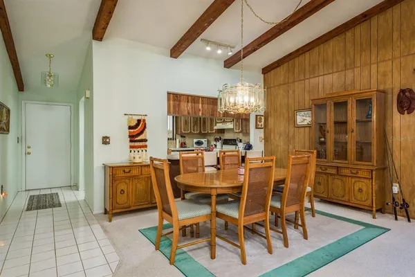 a dining area with furniture and window