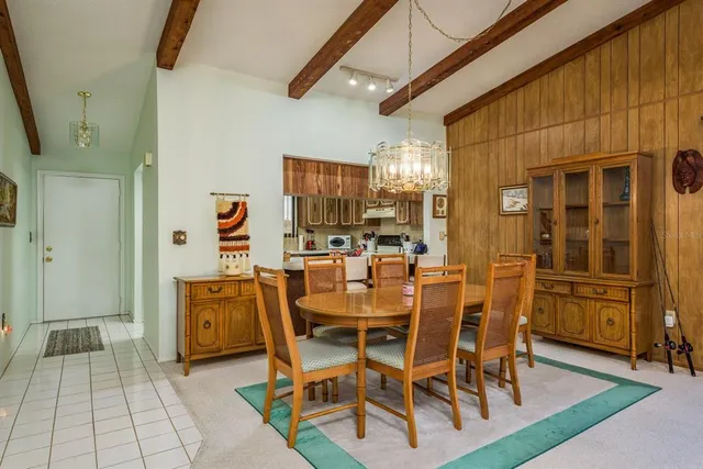 a dining area with furniture and window