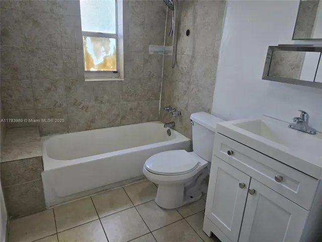 a bathroom with a sink a toilet and bathtub