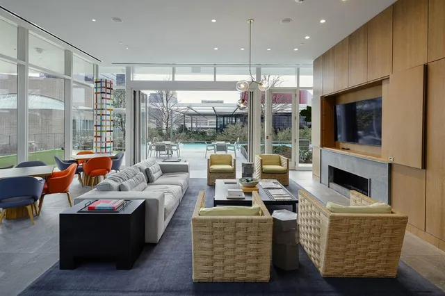 a lobby with furniture and floor to ceiling window
