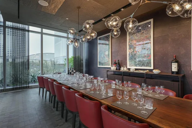 a spacious bedroom with a bed and a table