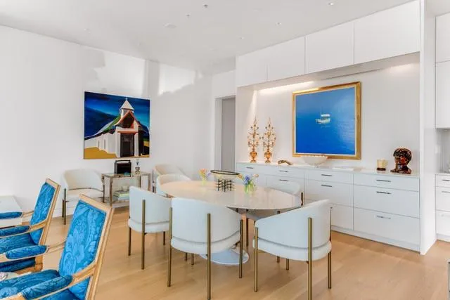 a kitchen with stainless steel appliances granite countertop a stove and a refrigerator