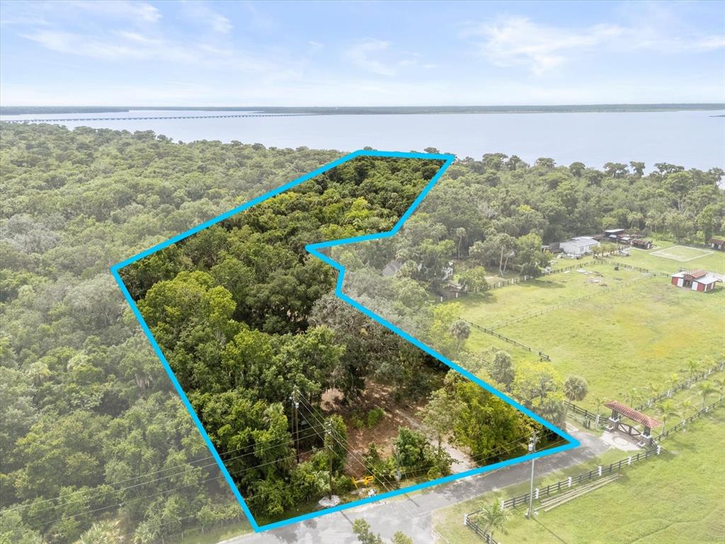 2301 Jeslan Court Oviedo, FL 32765 - Photo 2 of 26 a view of a swimming pool with a lake from a balcony