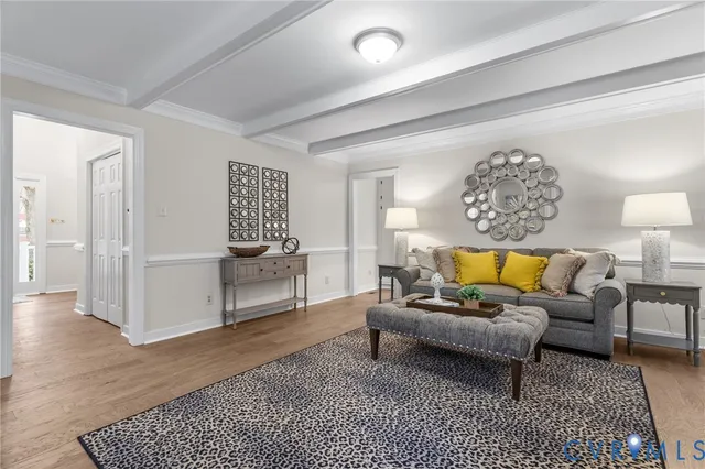 a living room with furniture and a rug