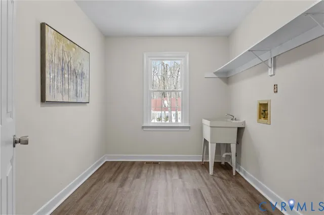 a bathroom with a granite countertop toilet a sink and a mirror