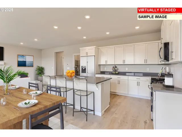 a kitchen with white cabinets sink and white appliances