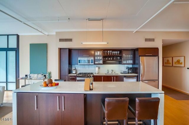 a open kitchen with a table and chairs in it