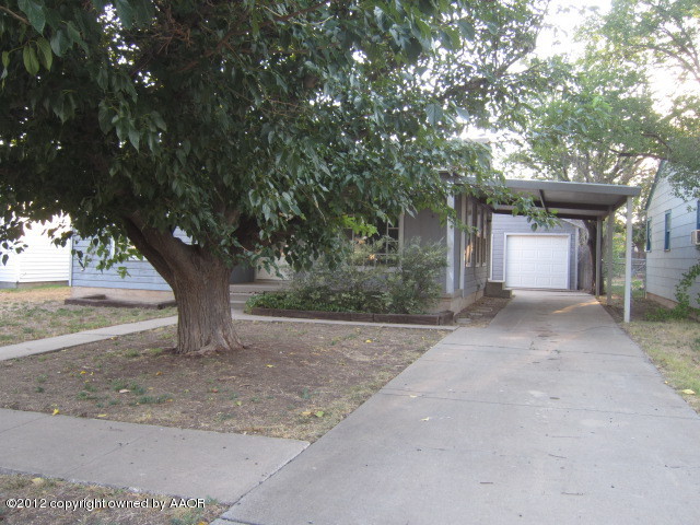 4114 Parker Street Amarillo, TX 79110 - Photo 1 of 15 a view of a house with a tree