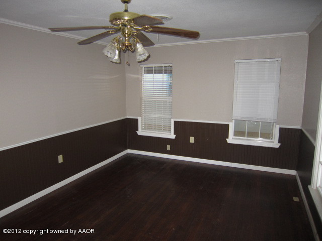 4114 Parker Street Amarillo, TX 79110 - Photo 14 of 15 a view of room with window and ceiling fan