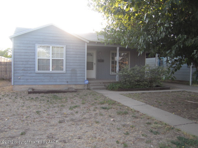 4114 Parker Street Amarillo, TX 79110 - Photo 3 of 15 a front view of a house with garden