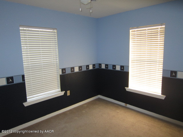 4114 Parker Street Amarillo, TX 79110 - Photo 5 of 15 a view of a window in an empty room