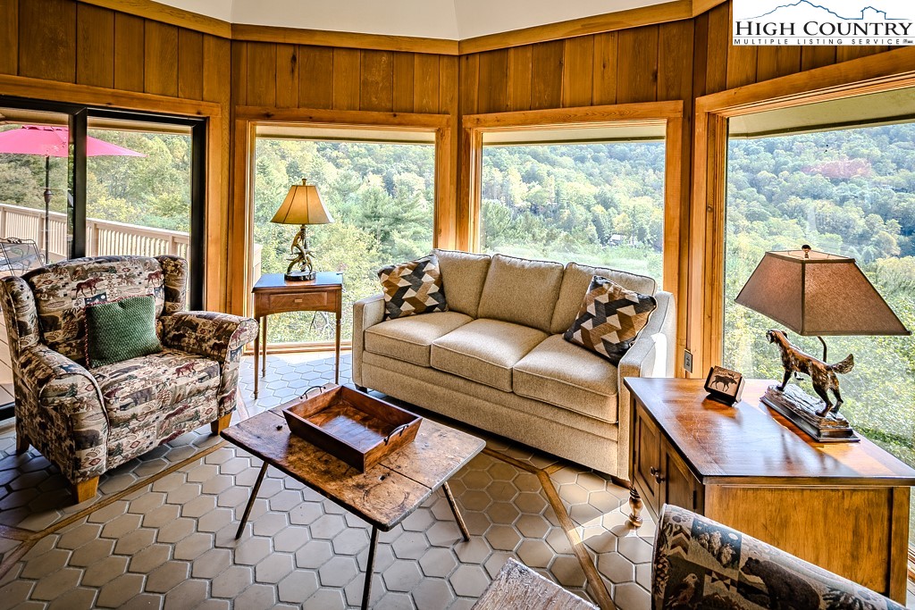 233 Balsam Road Boone, NC 28607 - Photo 14 of 50 a living room with furniture and a large window