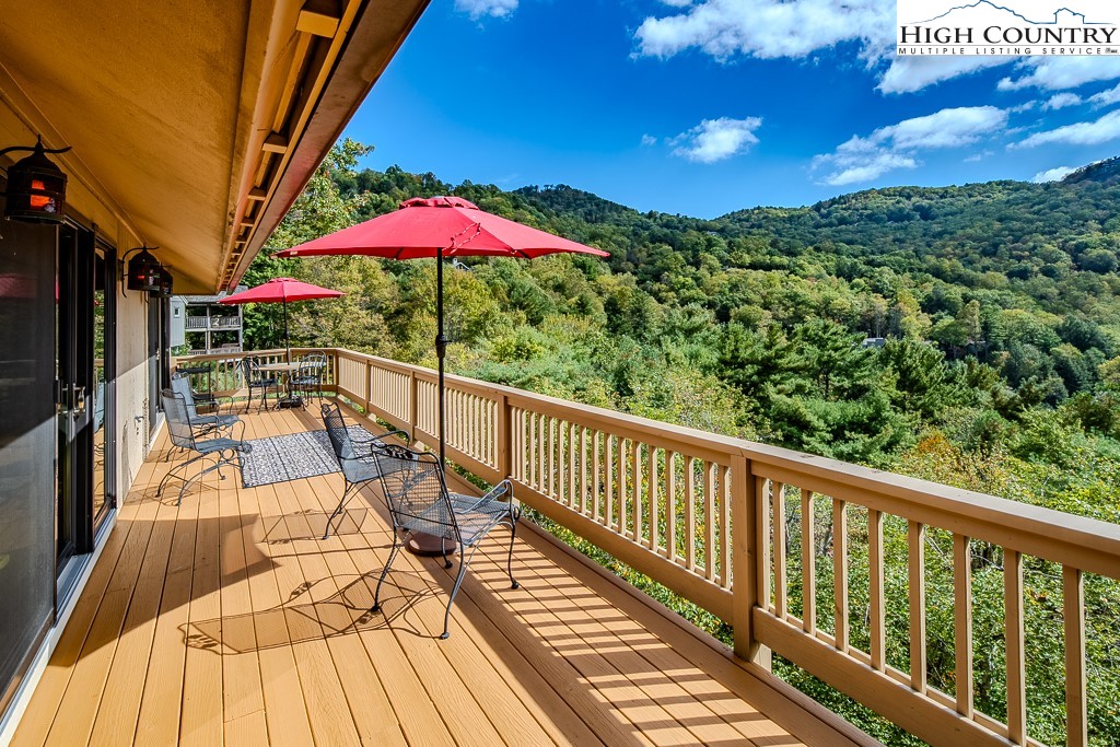 233 Balsam Road Boone, NC 28607 - Photo 15 of 50 a view of balcony with wooden floor and outdoor seating